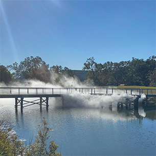 Fog art installation at lagoon footbridge
